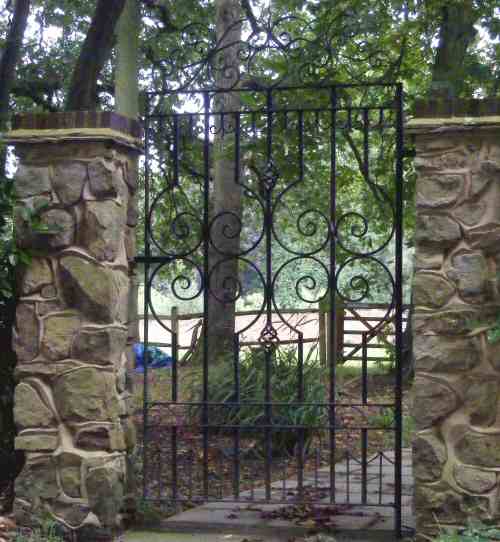 heavy weight wrought iron single gate with decorative hand forged scroll work